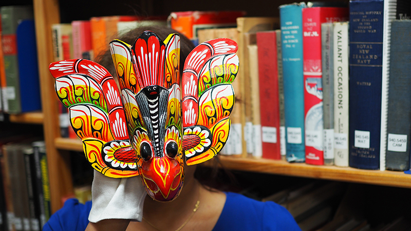 A brightly coloured Sri Lankan bird mask made of wood
