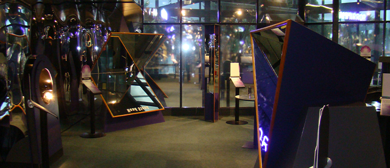 Full length mirrors stand in the exhibition space