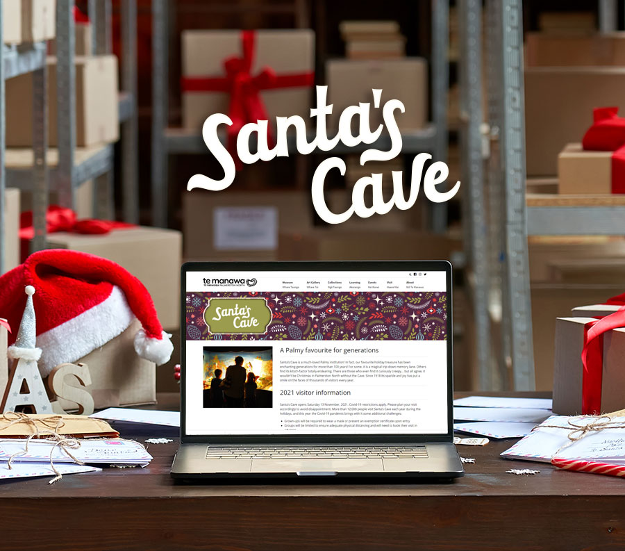 Picture of a laptop showing the Santa's Cave web-page