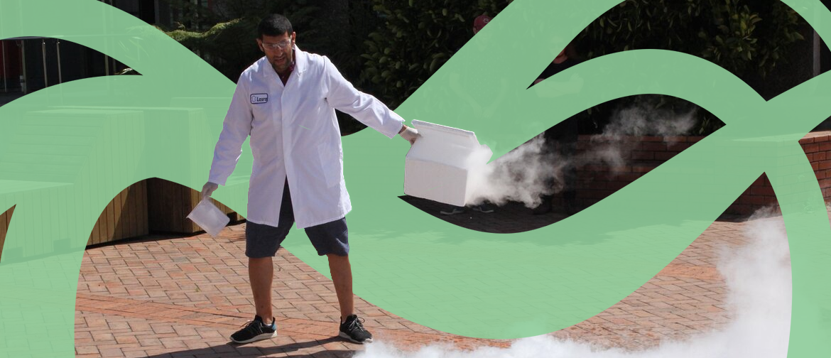 A scientist in a white coat spills dry ice