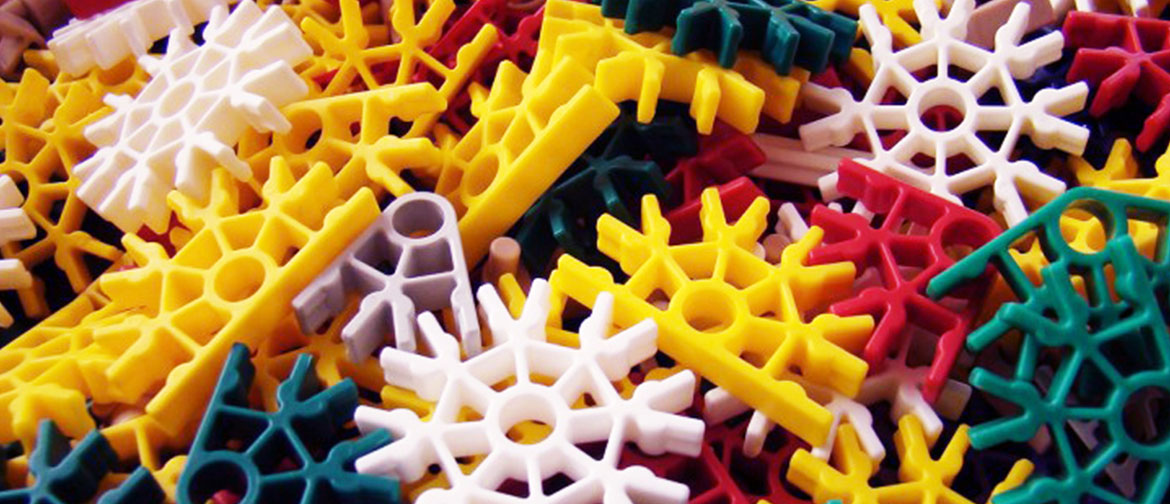 a close-up of a pile of k'nex pieces of different bright colours