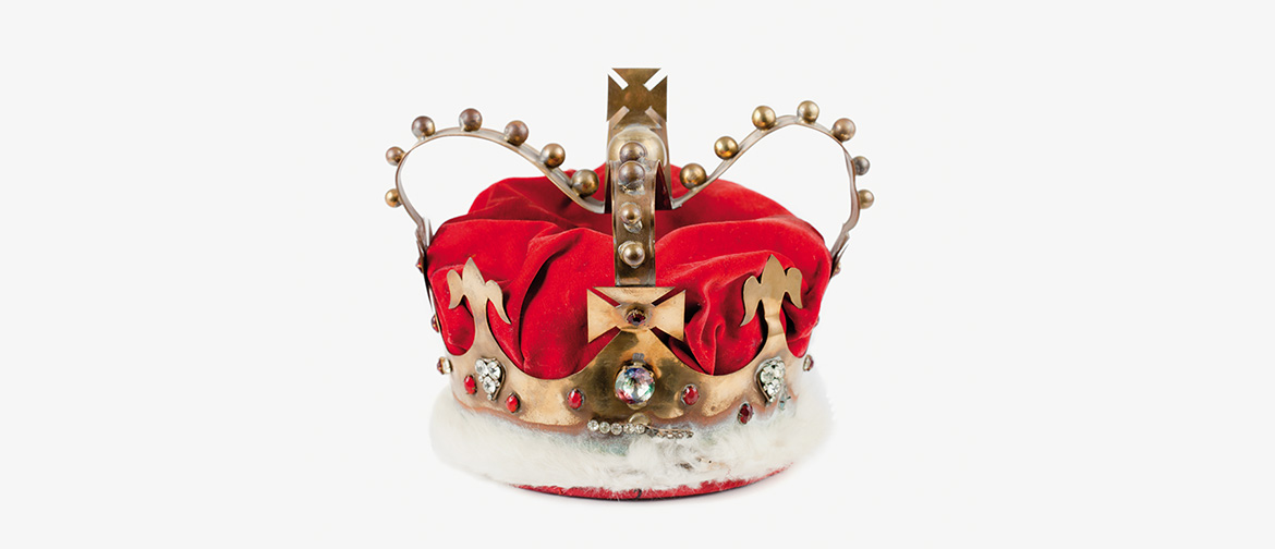 A crown, hand made from brass, red velvet and white rabbit fur.